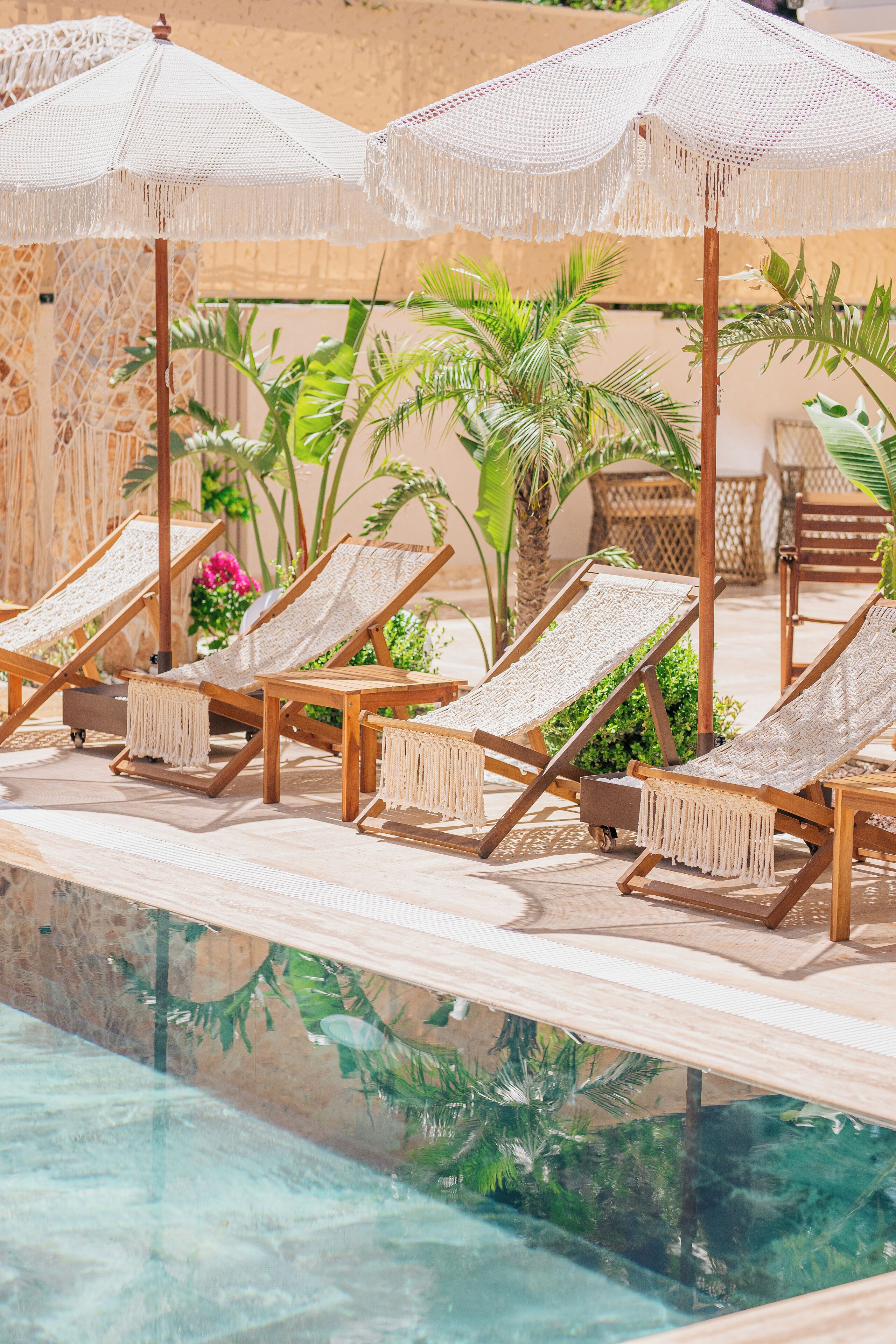 Seasonal outdoor pool, open 8:00 AM to 10:00 PM, pool umbrellas