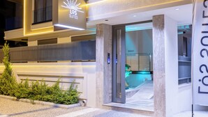 A modern hotel entrance with a sign reading "LGS Suites." - Los Suites (Konyaalti)