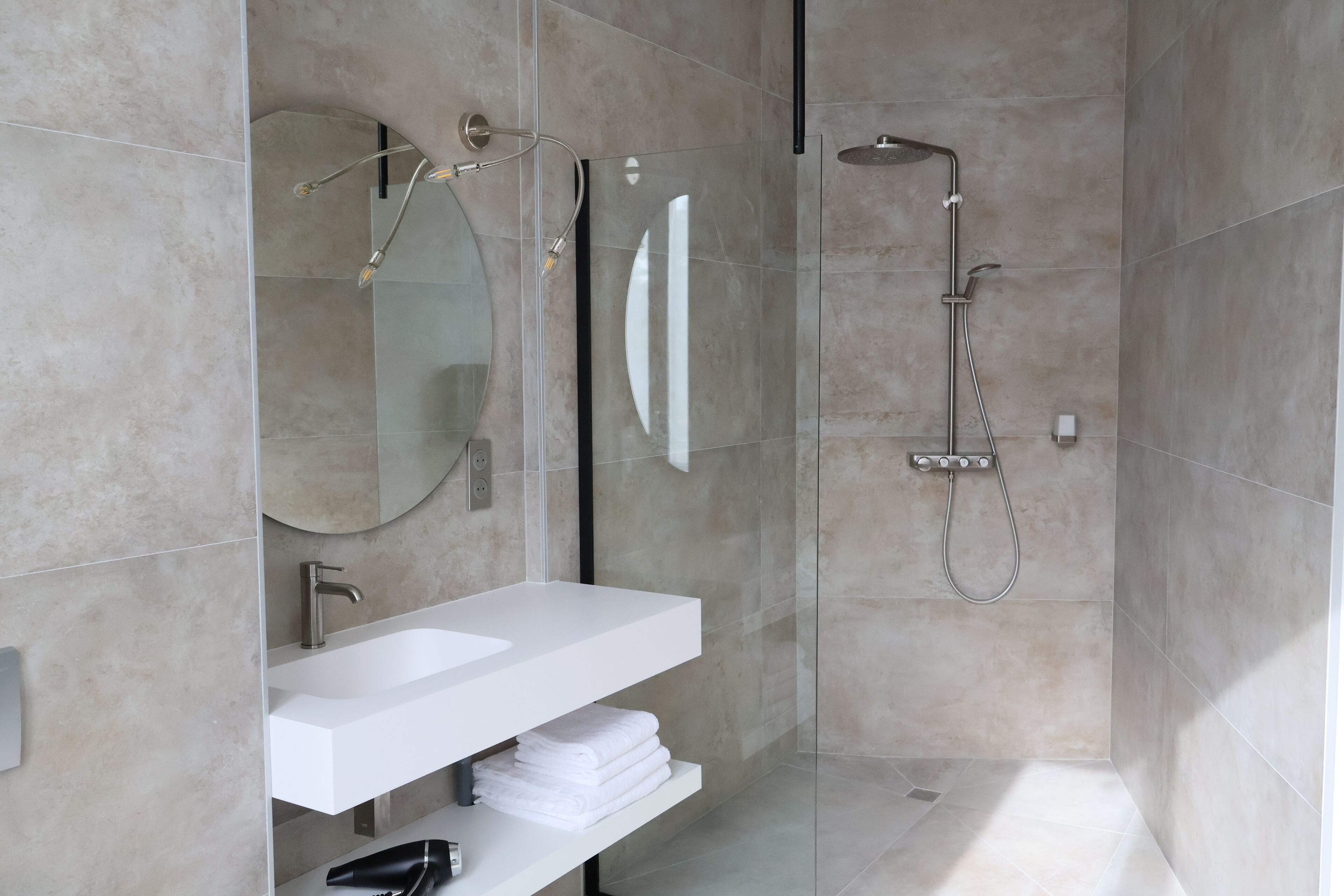 Shower, hair dryer, slippers, towels