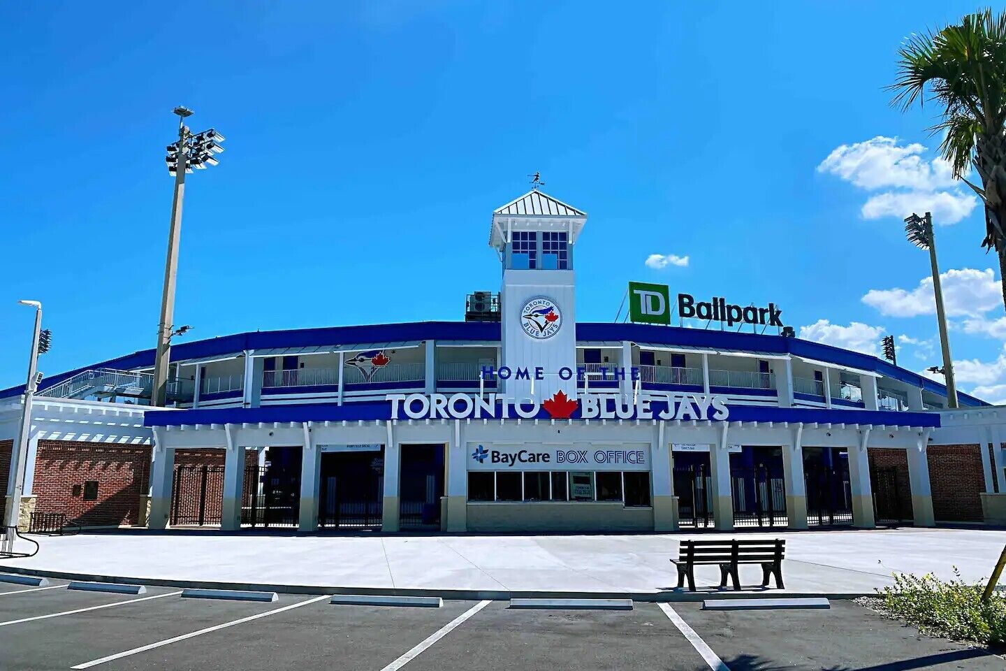 A stadium with a blue and white exterior, a tower, and a TD Ballpark sign.