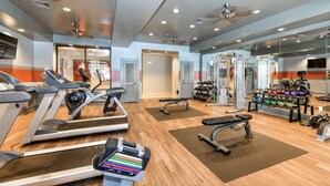 A gym with treadmills, weight machines, and free weights. - Landing | Amazing 1BD, Clubhouse, Pool (Memphis)