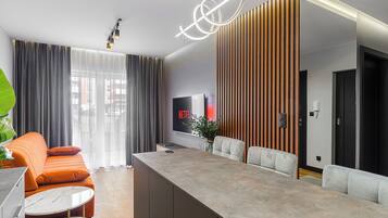 Exclusive Apartment | Living area | Flat-screen TV