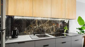 Exclusive Apartment | Private kitchen | Full-size fridge, stovetop, dishwasher, electric kettle