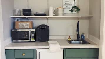 Fridge, microwave, coffee/tea maker, cookware/dishes/utensils