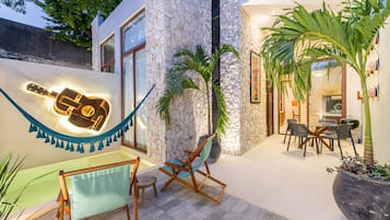 Deluxe House | Living area | 40-inch flat-screen TV with digital channels