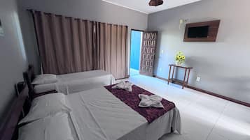 Standard Triple Room, Sea View | Desk, laptop workspace, bed sheets