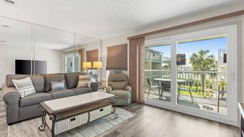 Condo, 1 Bedroom, Poolside | Living area | 60-inch LCD TV with cable channels