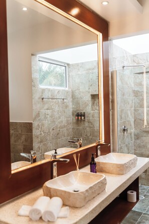 A bathroom with two sinks, a large mirror, and a shower. - Stunning new villa heated pool, 4 bedrooms, walk to Calle 7, outdoor dining (Tulum)