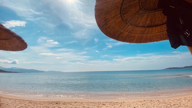 A beach scene with clear skies and calm waters. - HOUSE & PRIVATE SWIMMING POOL SEA VIEW very quiet (Porto-Vecchio)