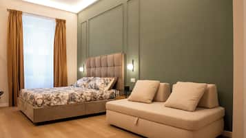 Habitació quàdruple Deluxe | Llençols de cotó egipci, roba de llit d'alta qualitat i cobrellits