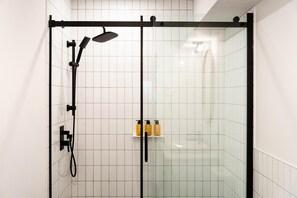 Shower, hair dryer, towels, shampoo