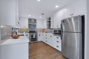 Fridge, microwave, oven, stovetop - Coachman Cottage, perfectly charming getaway for families or couples. (Wimberley)