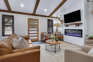 TV, fireplace - Coachman Cottage, perfectly charming getaway for families or couples. (Wimberley)