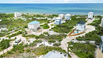 Coastal property with single-story buildings and beachfront views.