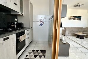 Fridge, oven, dishwasher, dining tables