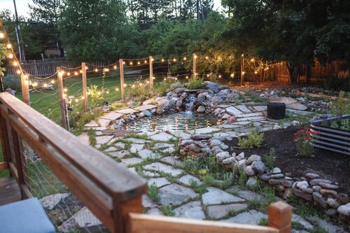 Modern dog-friendly retreat, with large deck, gardens, pond, and trails.