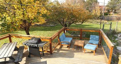 Modern dog-friendly retreat, with large deck, gardens, pond, and trails.