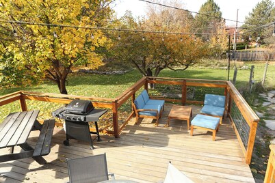 Modern dog-friendly retreat, with large deck, gardens, pond, and trails.