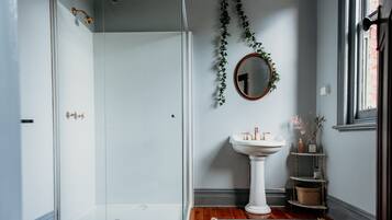Comfort Room, 1 Queen Bed | Bathroom | Hair dryer, slippers, towels, soap