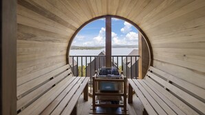 A wooden deck with a view of a lake and mountains. - Nine Lakefront Homes (sleeping 223) in Rocky Shores w/n 500ft (HOLLISTER)