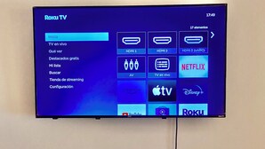 A television mounted on a wall displaying a Roku TV interface with various streaming options. - Come In (Puerto Vallarta)