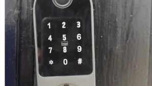 A numeric keypad lock on a door. - Come In (Puerto Vallarta)