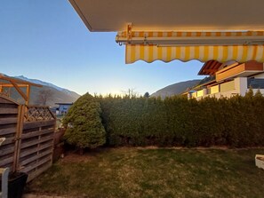Enjoy a serene view of lush greenery and a well-manicured lawn from this peaceful residential setting.
