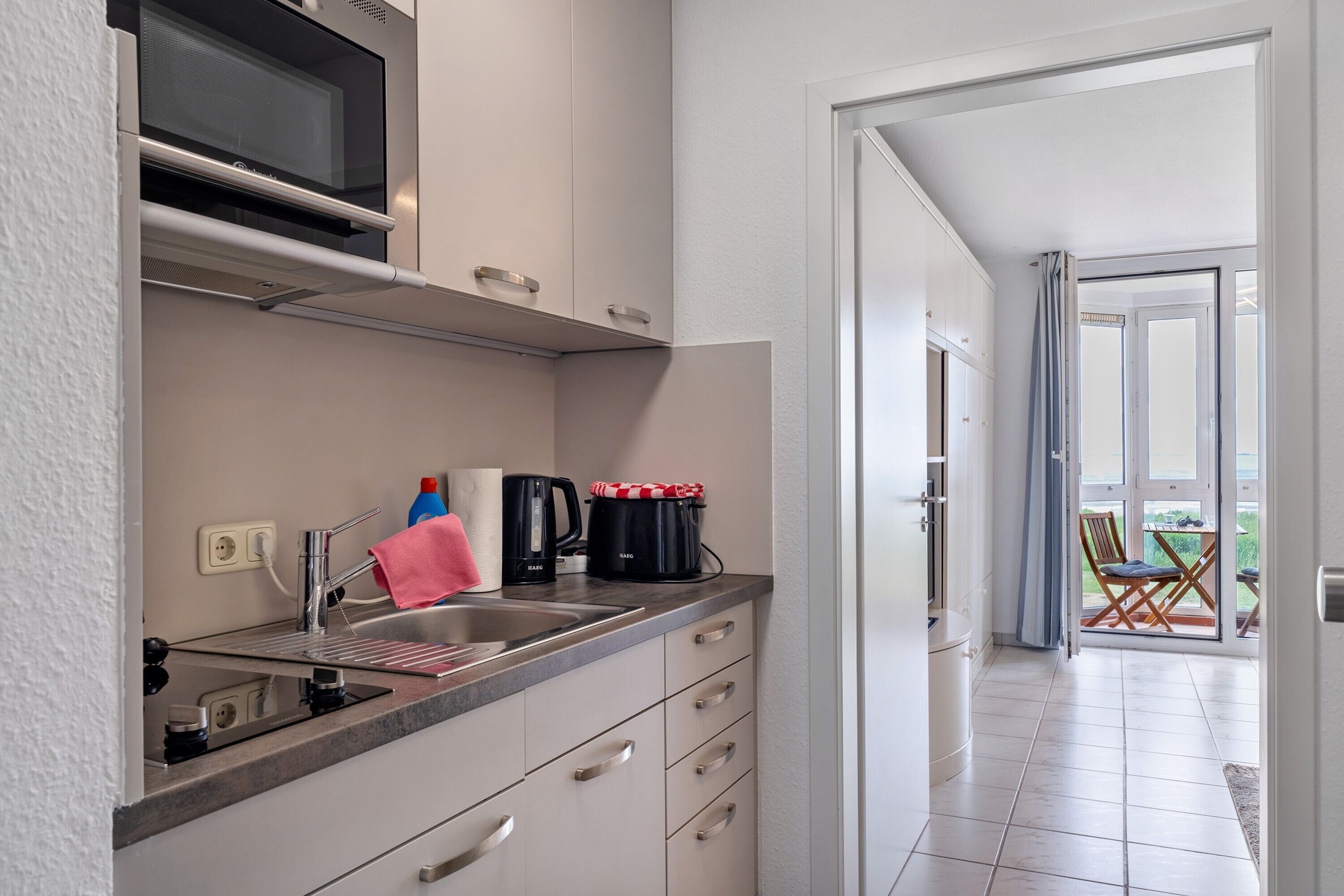 Fridge, microwave, stovetop, coffee/tea maker