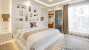 A modern bedroom with a large bed, built-in shelves, a glass door leading to a balcony, and a skylight. - 2BR Private Pool Villa Dove By Orivista (Mengwi)