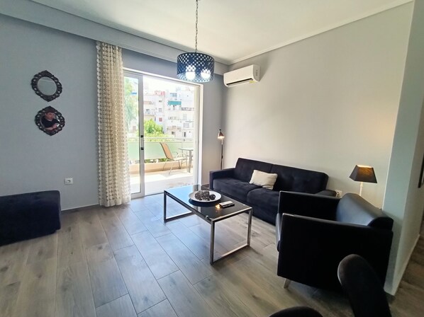 Comfort Apartment, City View | Living area | 49-inch Smart TV with digital channels - Highlighted Retreat (Athens)