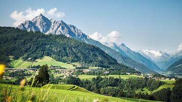 A mountainous landscape with a village nestled in the valley.