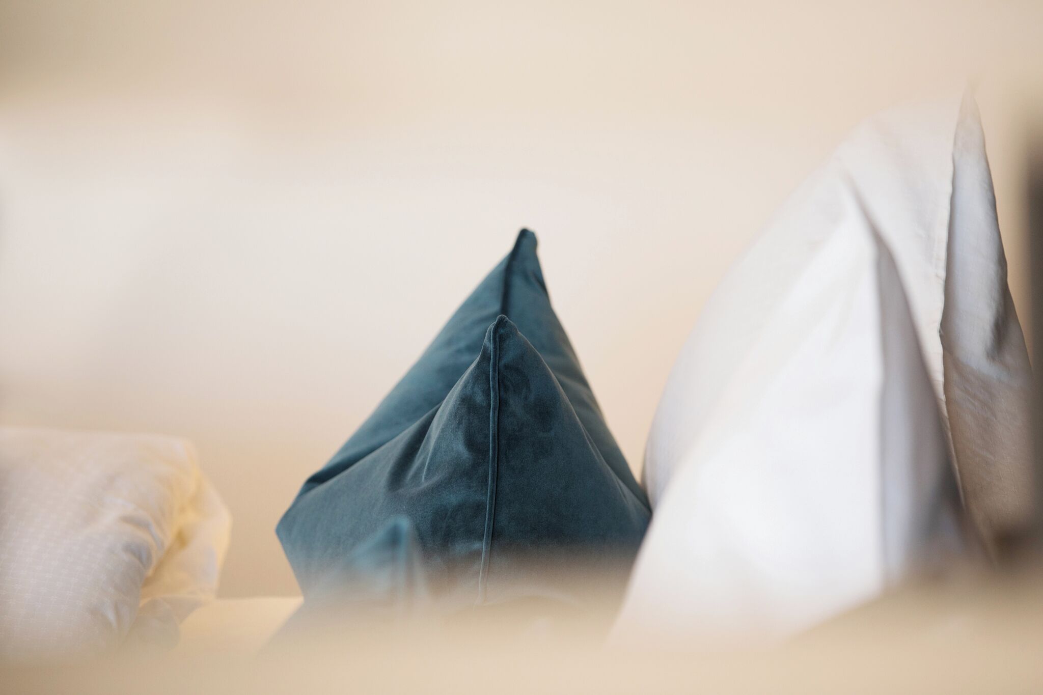 A close-up of pillows on a bed.