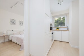 Apartment, 1 Bedroom, Balcony | 1 bedroom, desk, laptop workspace, iron/ironing board - Cosy Apartment for 4 by Renters (Warsaw)