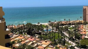 A coastal resort with multiple buildings, a beach, and palm trees. - 8th Floor Penthouse with View of Sea in Resort with 8 Pools (Puerto Peñasco)