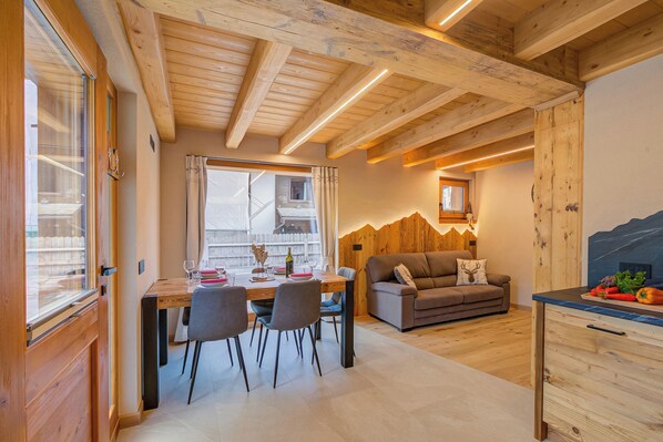 Family Apartment, 2 Bedrooms (Casa Fiorita) | Living area | 21-inch flat-screen TV with satellite channels, fireplace