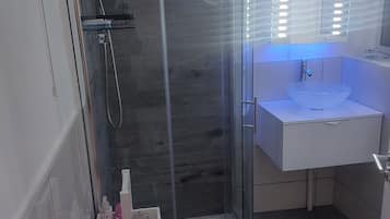 Shower, hair dryer, towels, soap