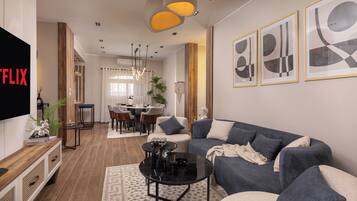 Appartement Présidentiel, 4 chambres, balcon, vue partielle sur la mer | Coin séjour | TV connectée de 55 pouces avec chaînes par câble, Netflix