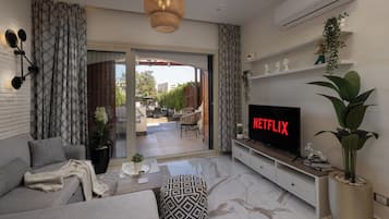 Superior Apartment, 2 Bedrooms, Balcony | Living area | 55-inch Smart TV with cable channels, Netflix, streaming services