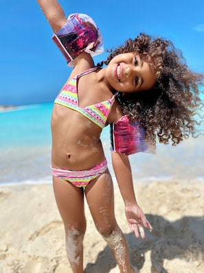 On the beach, white sand, sun-loungers, beach umbrellas