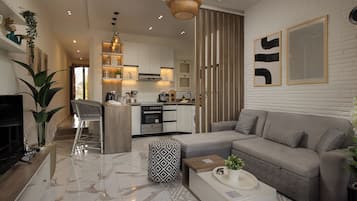 Superior Apartment, 2 Bedrooms, Balcony | Living area | 55-inch Smart TV with cable channels, Netflix, streaming services