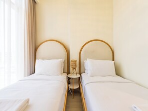 Deluxe-huoneisto, kaupunkinäköala | 3 makuuhuonetta, tallelokero huoneessa, silitysrauta/-lauta