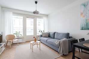 Premier Apartment, Courtyard View | Living area | 40-inch LED TV with cable channels - Modern 3BR Apartment with Best Location (Tampere)