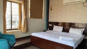 Luxury Room, Private Bathroom, City View | 1 bedroom, desk, laptop workspace, blackout curtains