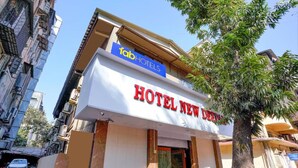 A hotel named "HOTEL NEW DENMARK" with a sign for "fabHOTELS" above it. - FabExpress New Deepak (Mumbai)