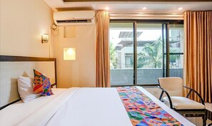 Deluxe Room | Egyptian cotton sheets, premium bedding, in-room safe, free WiFi - FabExpress Prabhu Sharan (Navi Mumbai)
