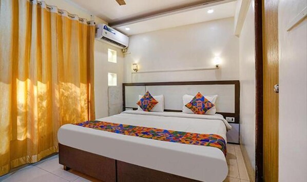 Deluxe Room | Egyptian cotton sheets, premium bedding, in-room safe, free WiFi - FabExpress Prabhu Sharan (Navi Mumbai)