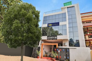 A building with a sign for 'Fab Hotels' and 'Lucknow Inn' indicating rooms, banquet, and restaurant facilities. - FabHotel Lucknow Inn (Lucknow)