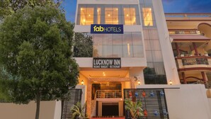A building with a sign for 'FabHotels' and 'Lucknow Inn' indicating it is a hotel and banquet restaurant. - FabHotel Lucknow Inn (Lucknow)