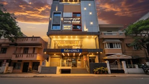 A modern hotel with a prominent sign for 'fahHOTELS' and 'ROYAL GRAND'. - FabHotel Royal Grand (Bengaluru)