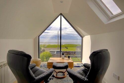 A 3-bedroom beach front house with spectacular views across the Dornoch First.